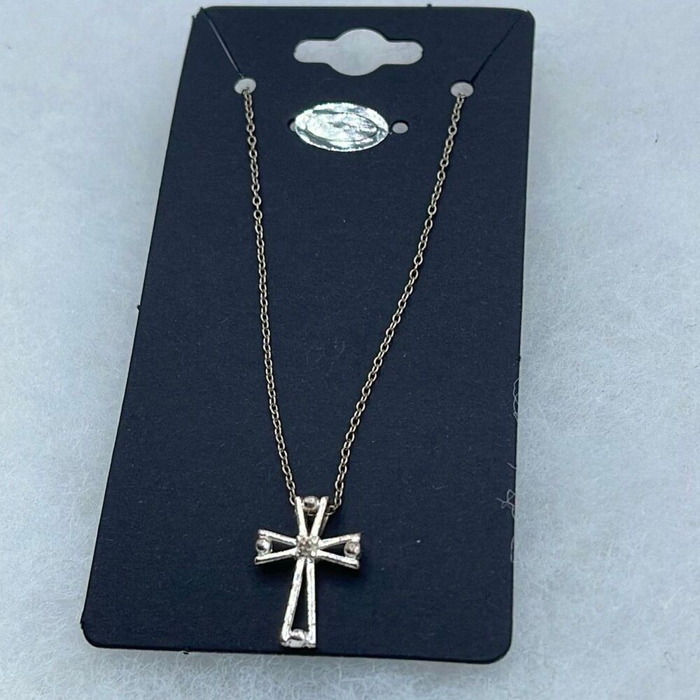 Sterling silver chain and cross pendant necklace.